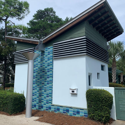Wall Mount Mailbox mounted to outdoor wall. ButterFly Box in arctic white and jet black