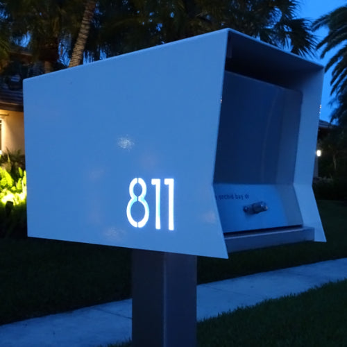 The Original UptownBox in ARCTIC WHITE - Modern Mailbox white at night